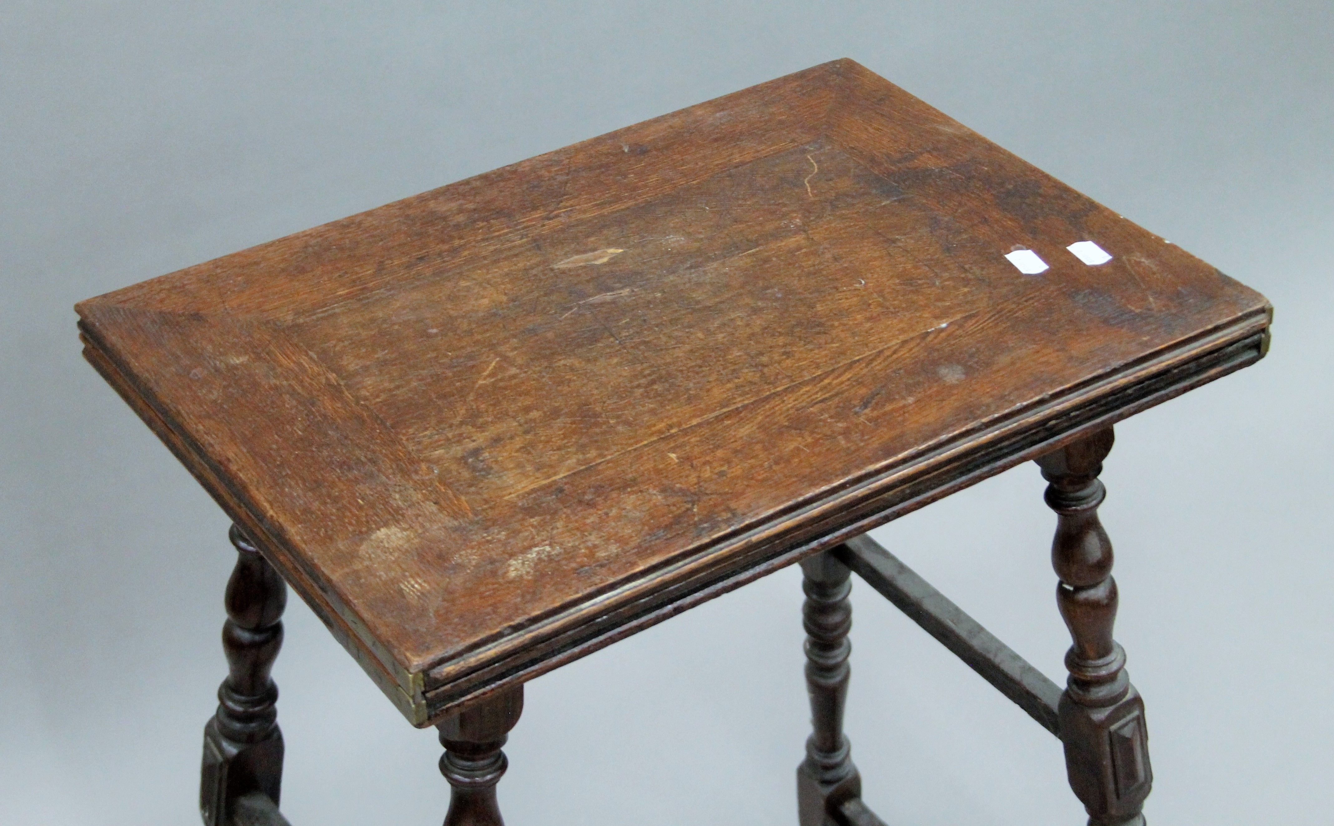 A Victorian oak folding tea table. 54.5 cm wide. - Image 3 of 9