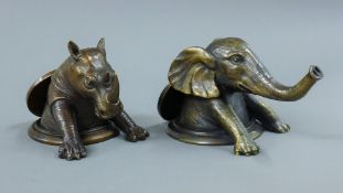 A pair of elephant and rhino desk weights. The former 9 cm high.