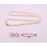 A pearl necklace with 9 ct gold clasp,