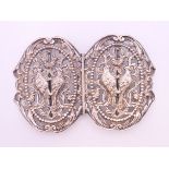 A pierced silver nurses buckle centred with birds. 10 x 7 cm.