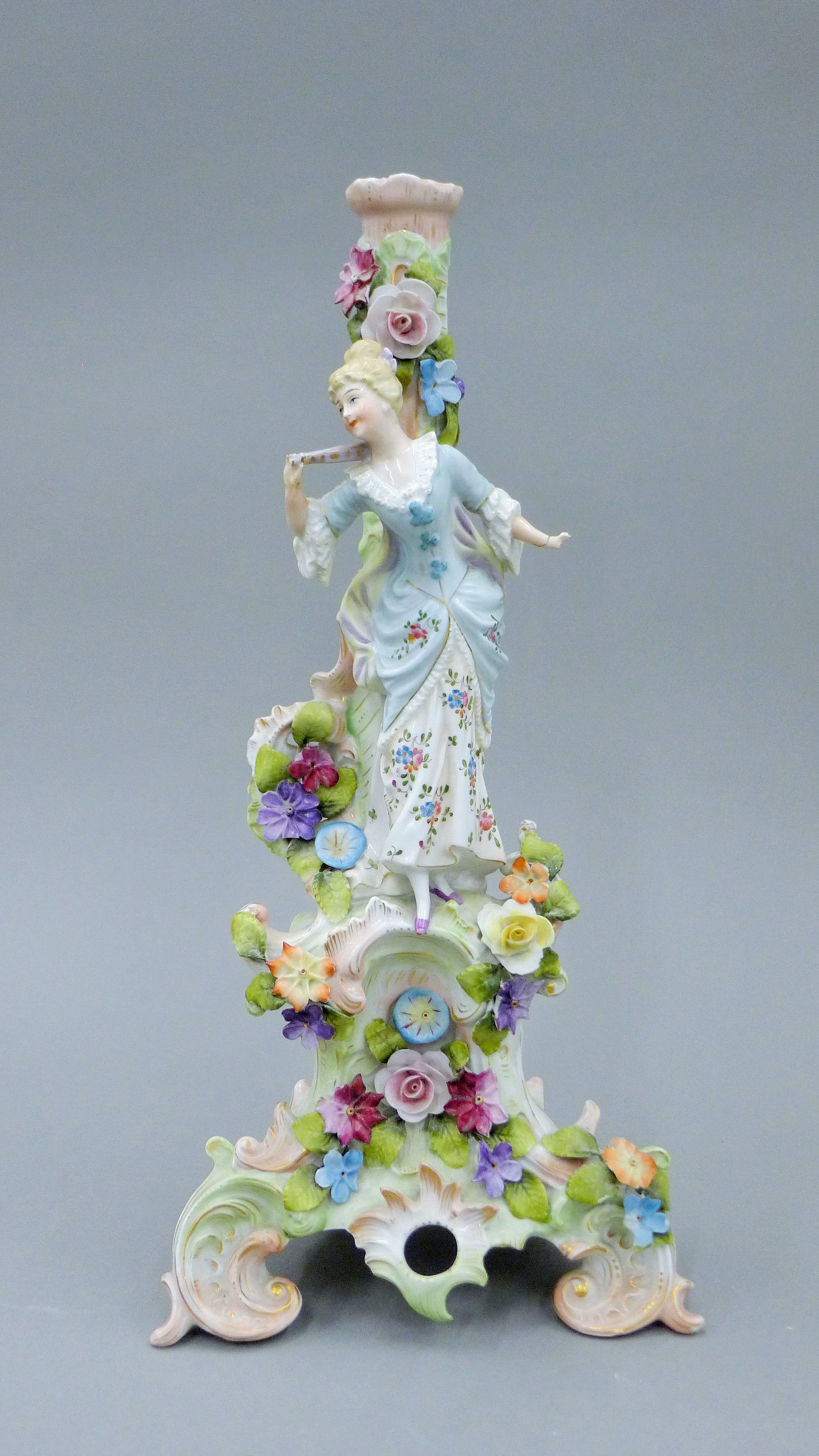 An early 20th century Continental porcelain figural candelabra base, probably Sitzendorf.