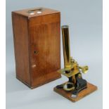 A Victorian mahogany cased brass microscope. The case 33.5 cm high.