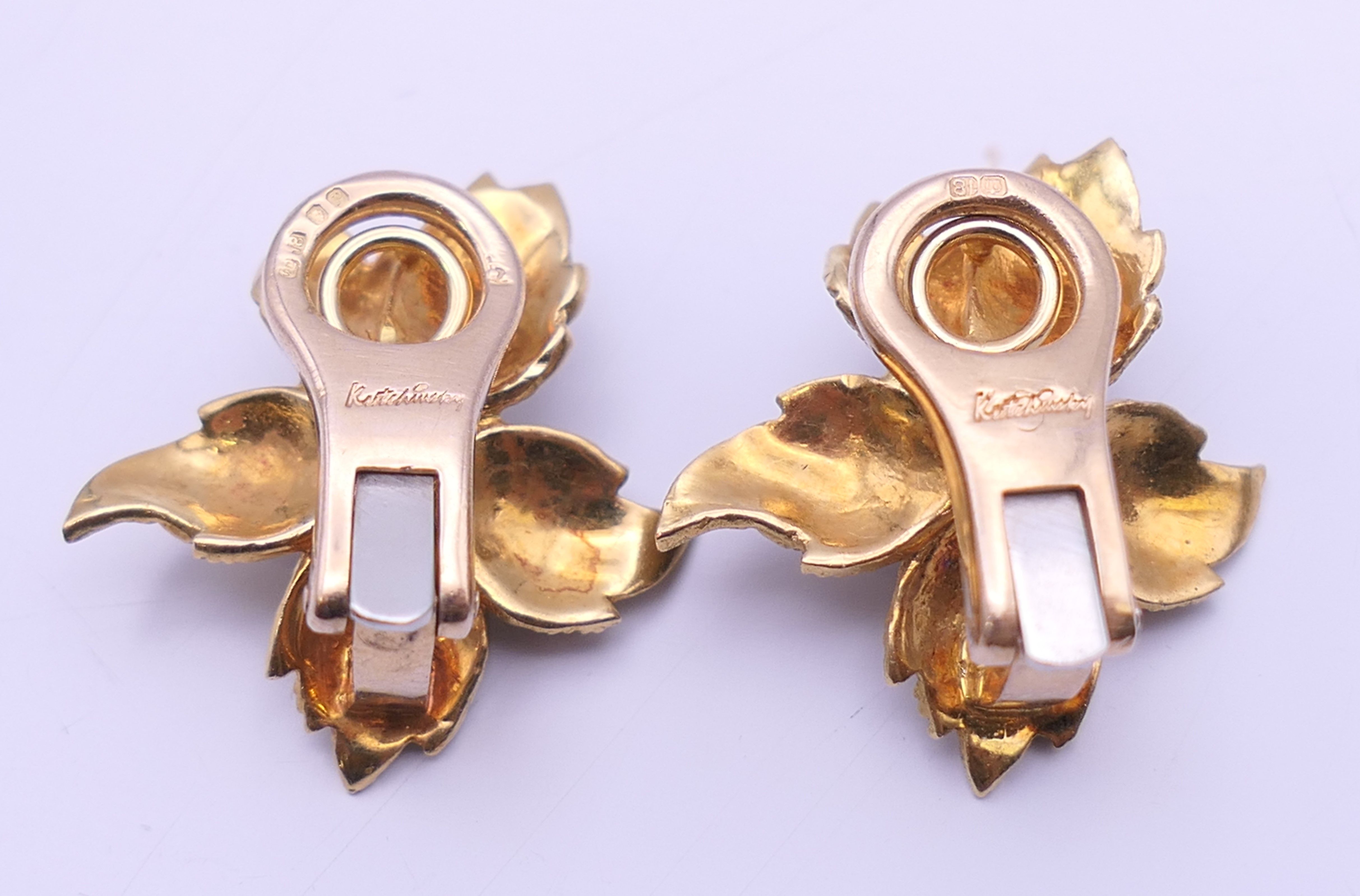 A Kutchinsky 18 ct gold diamond and sapphire set matching brooch and clip earrings of floral form. - Image 10 of 11