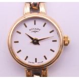 A 9 ct gold cased Rotary ladies wristwatch. 1.5 cm wide. 13.5 grammes total weight.