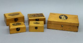 Five Mauchlineware boxes. The largest 19 cms wide.