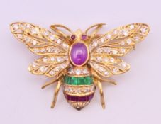 A Theo Fennell unmarked, probably 18 ct gold diamond and multi gem set butterfly form brooch,