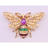 A Theo Fennell unmarked, probably 18 ct gold diamond and multi gem set butterfly form brooch,