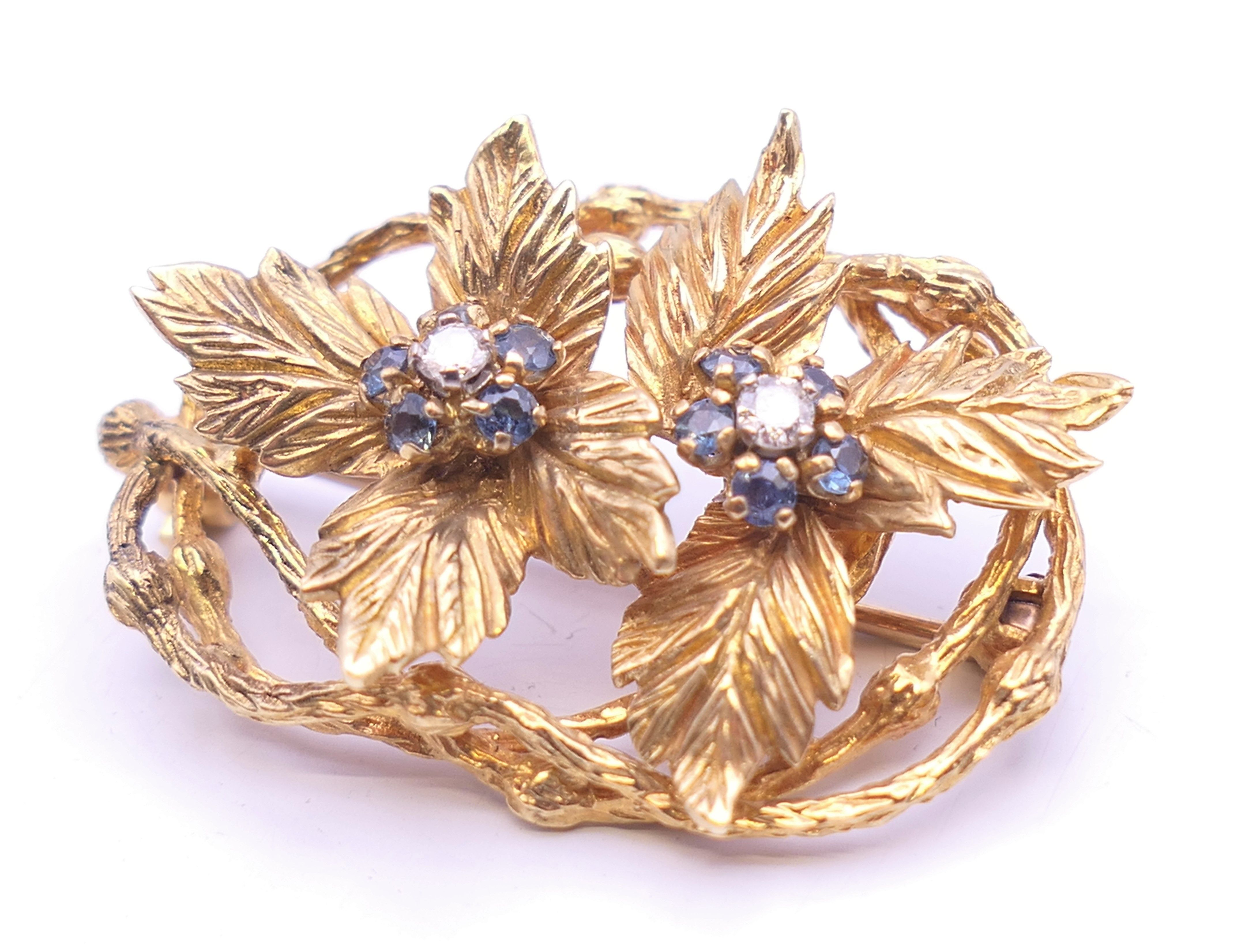 A Kutchinsky 18 ct gold diamond and sapphire set matching brooch and clip earrings of floral form. - Image 3 of 11