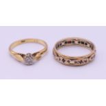 An 18 ct gold diamond solitaire ring and an eternity ring. 6.2 grammes total weight.