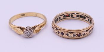 An 18 ct gold diamond solitaire ring and an eternity ring. 6.2 grammes total weight.