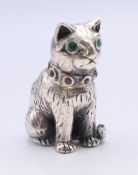A silver pin cushion formed as a cat (lacking pad). 2.5 cm high.