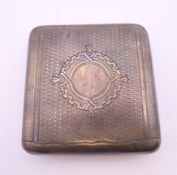 A Russian silver cigarette case. 8.25 x 8.5 cm. 120.5 grammes total weight.