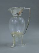 A Christopher Dresser style silver plated crow foot jug. 25.5 cm high.