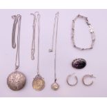 A quantity of silver jewellery, including earrings, lockets, an 1893 shilling pendant necklace,