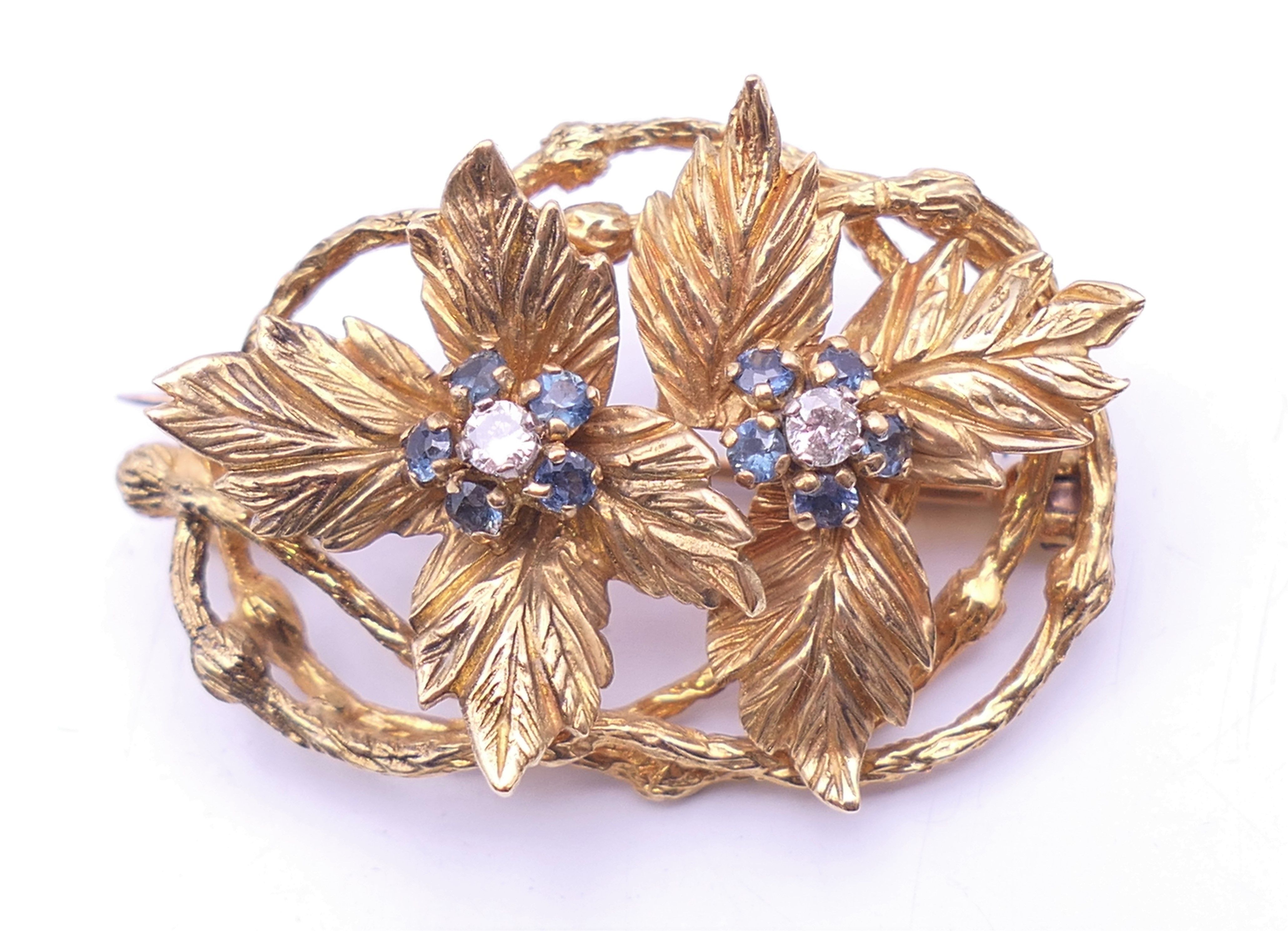 A Kutchinsky 18 ct gold diamond and sapphire set matching brooch and clip earrings of floral form. - Image 2 of 11