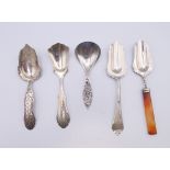 Five Continental silver caddy spoons. Largest 12.5 cm long.