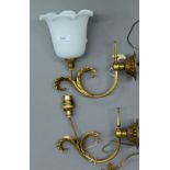 Two brass wall lights, one with milk glass shade. The shade 11.5 cm high.