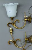 Two brass wall lights, one with milk glass shade. The shade 11.5 cm high.