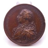 A George III bronze medallion commemorating land and sea victories, dated 1798. 5 cm diameter.