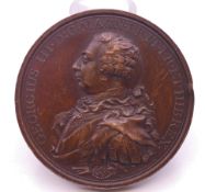 A George III bronze medallion commemorating land and sea victories, dated 1798. 5 cm diameter.