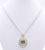 A silver hallmarked stone set pendant on a silver chain. Pendant 2.5 cm square, chain 48 cm long.