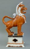 A large Chinese pottery dog-of-fo. 79 cm high.