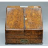 A Victorian walnut stationery box with applied presentation plaque 'Presented to The Rev.