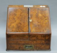 A Victorian walnut stationery box with applied presentation plaque 'Presented to The Rev.
