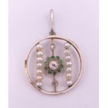 A Victorian diamond and seed pearl pendant. 2 cm diameter.