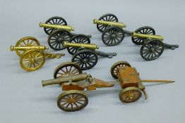 A quantity of model cannons. The largest 22 cms long.