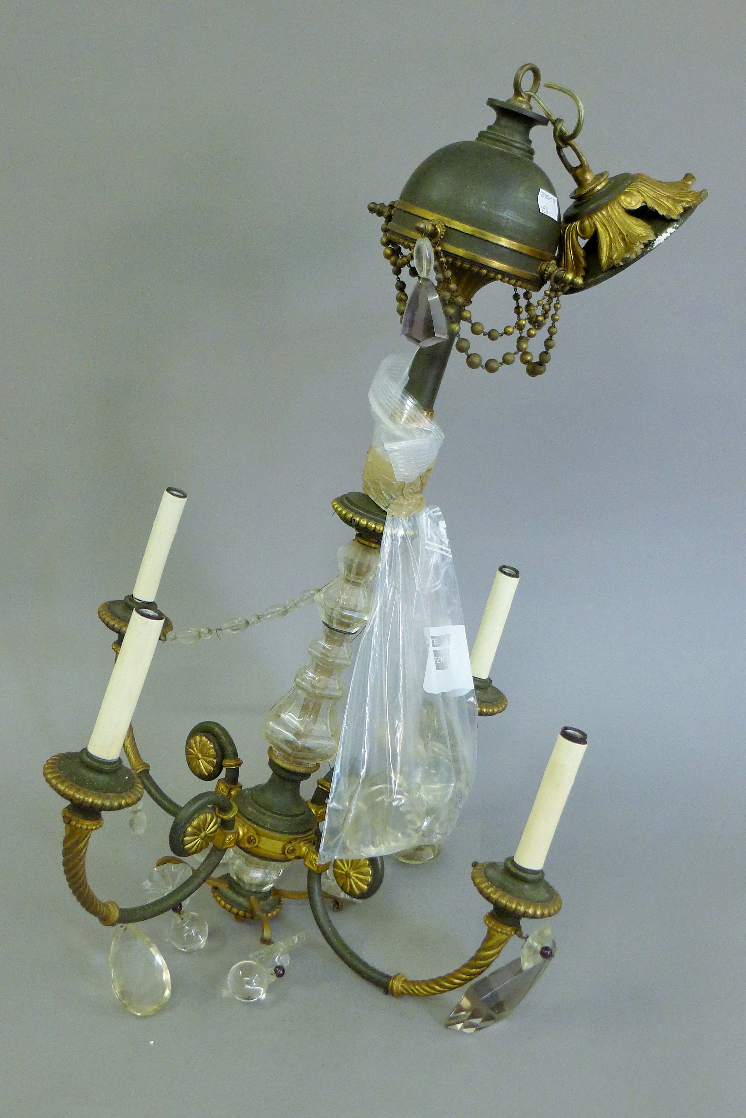 A bronze and cut glass chandelier. Approximately 70 cm high.