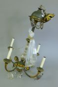 A bronze and cut glass chandelier. Approximately 70 cm high.
