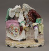 A 19th century Continental porcelain figural group. 23 cm wide.