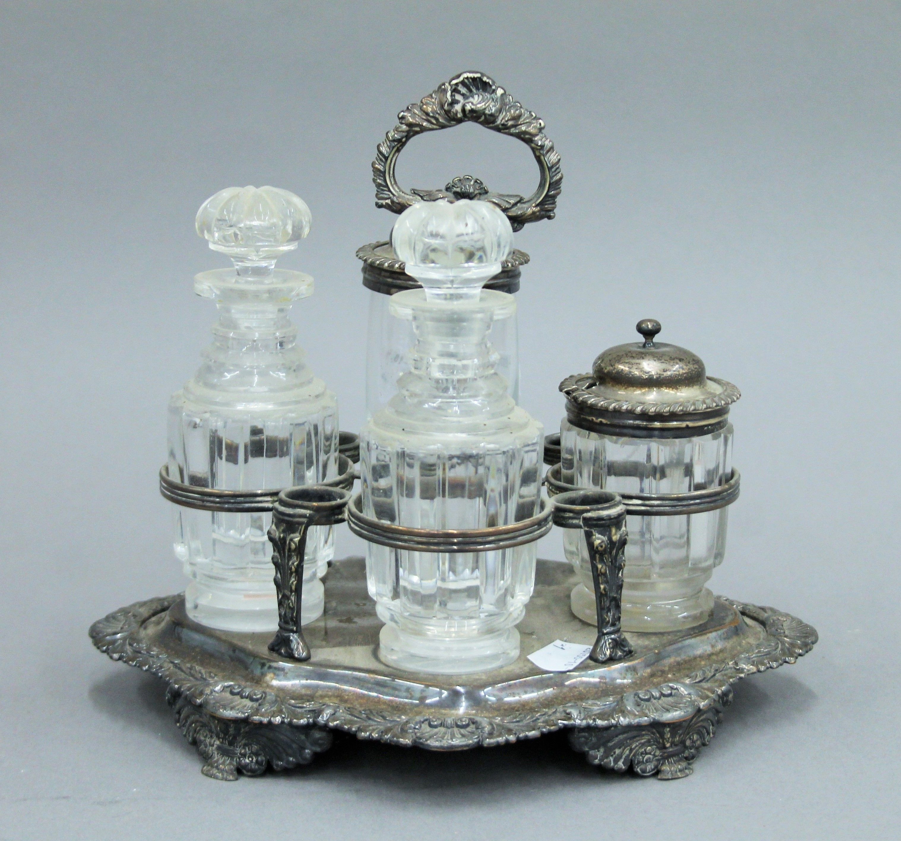 A silver plated cruet stand with associated fittings, two with silver mounts and a small silver lid. - Image 3 of 5