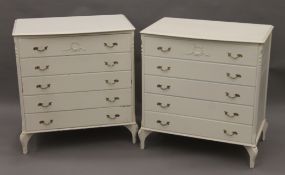 A pair of white painted chest of drawers. 82 cm wide.