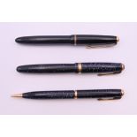 A Parker Blue Diamond fountain pen and propelling pencil, and another Parker Fountain pen.