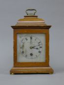 A bracket clock, the dial inscribed 'Sharman D Neill Ltd Belfast'. 27 cm high.