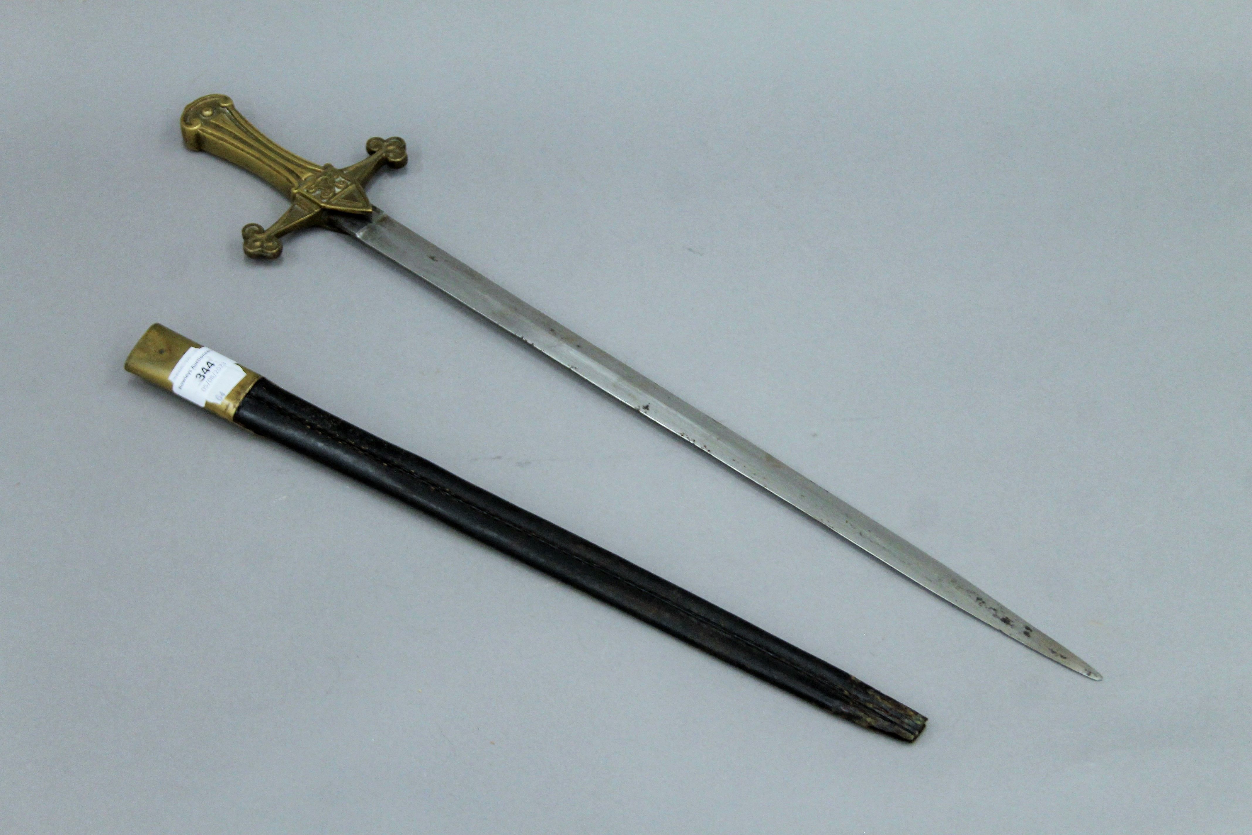 A Victorian short sword in scabbard. 64.5 cm long. - Image 2 of 7