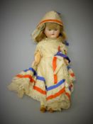 A bisque headed doll by Kammer and Reinhardt. 21 cm high.