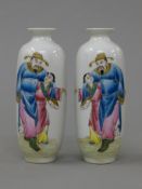 A pair of small Chinese porcelain vases. 14 cm high.
