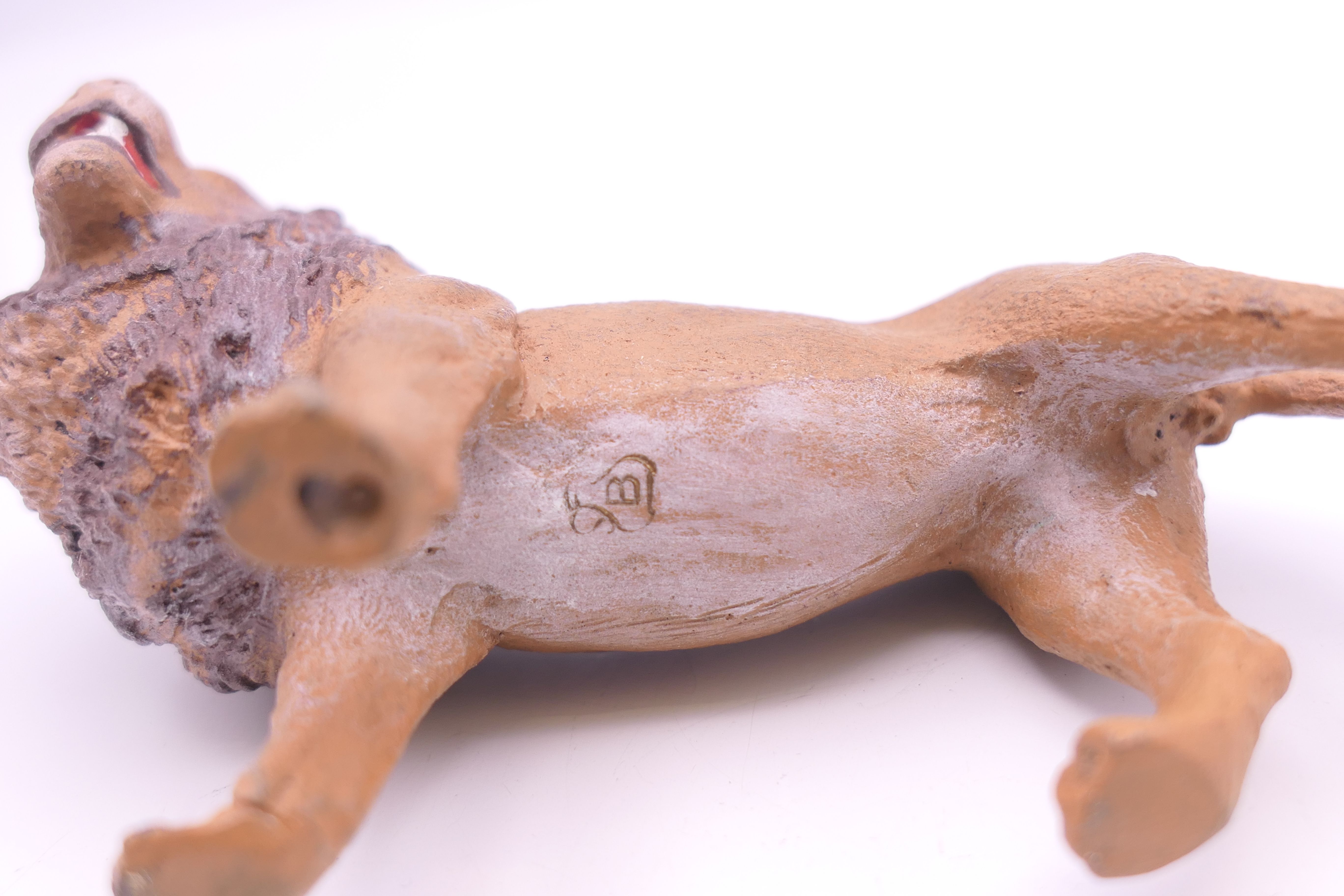 A cold painted bronze model of a lion. 9 cm long. - Image 4 of 4