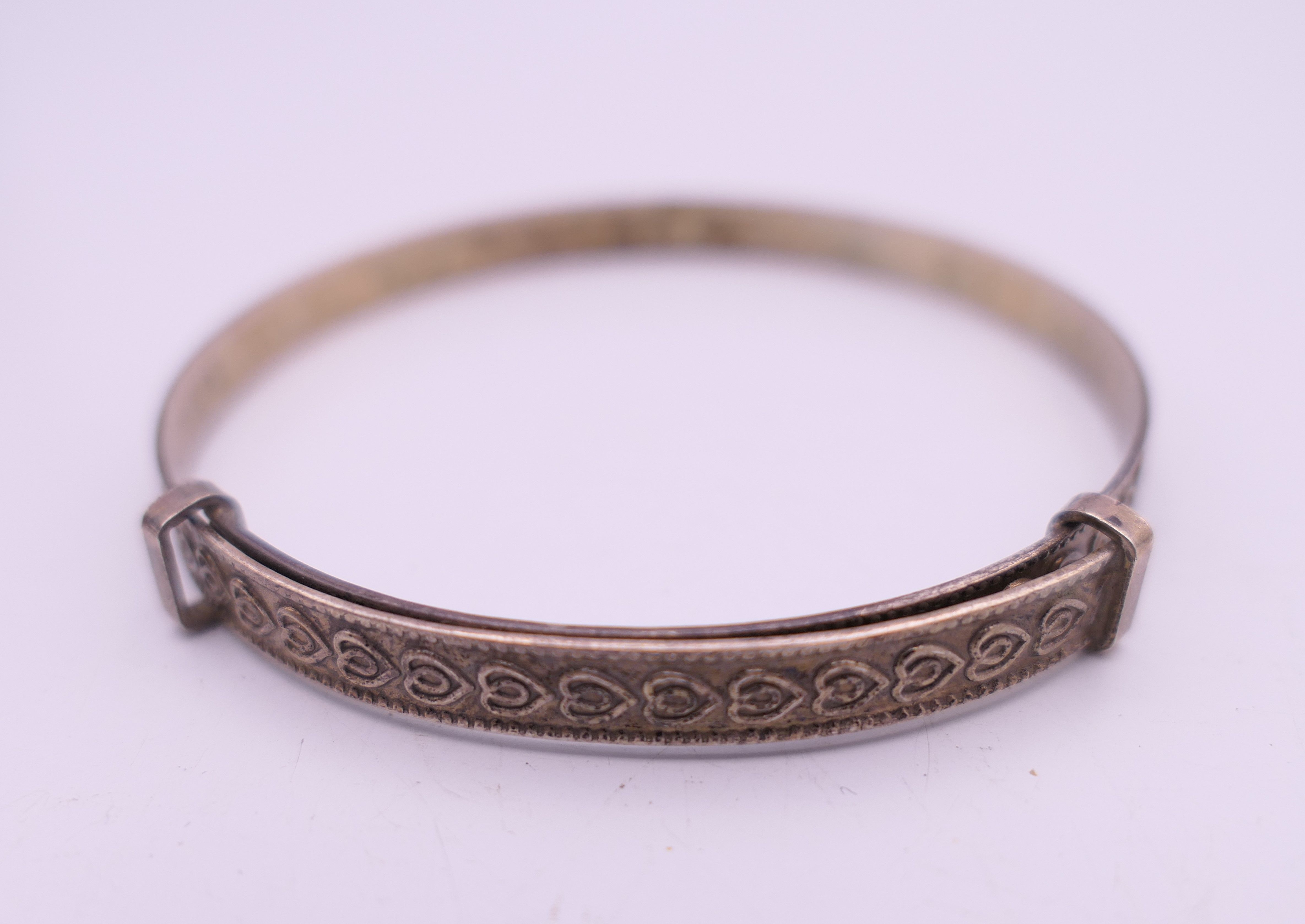 Four silver bangles. The largest 6.5 cm wide. 93.4 grammes. - Image 11 of 15