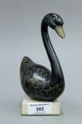 A patinated bronze model of a swan mounted on a marble plinth base. 16 cm high.