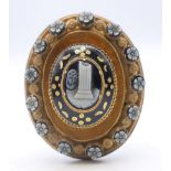 A Victorian mourning brooch with cameo roundels. 4.5 cm high.