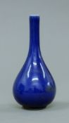 A small Chinese blue porcelain straight neck vase. 15 cm high.