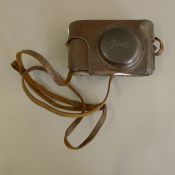 A copy of a Leica camera bearing a Luftwaffe insignia. 14.5 cm long.