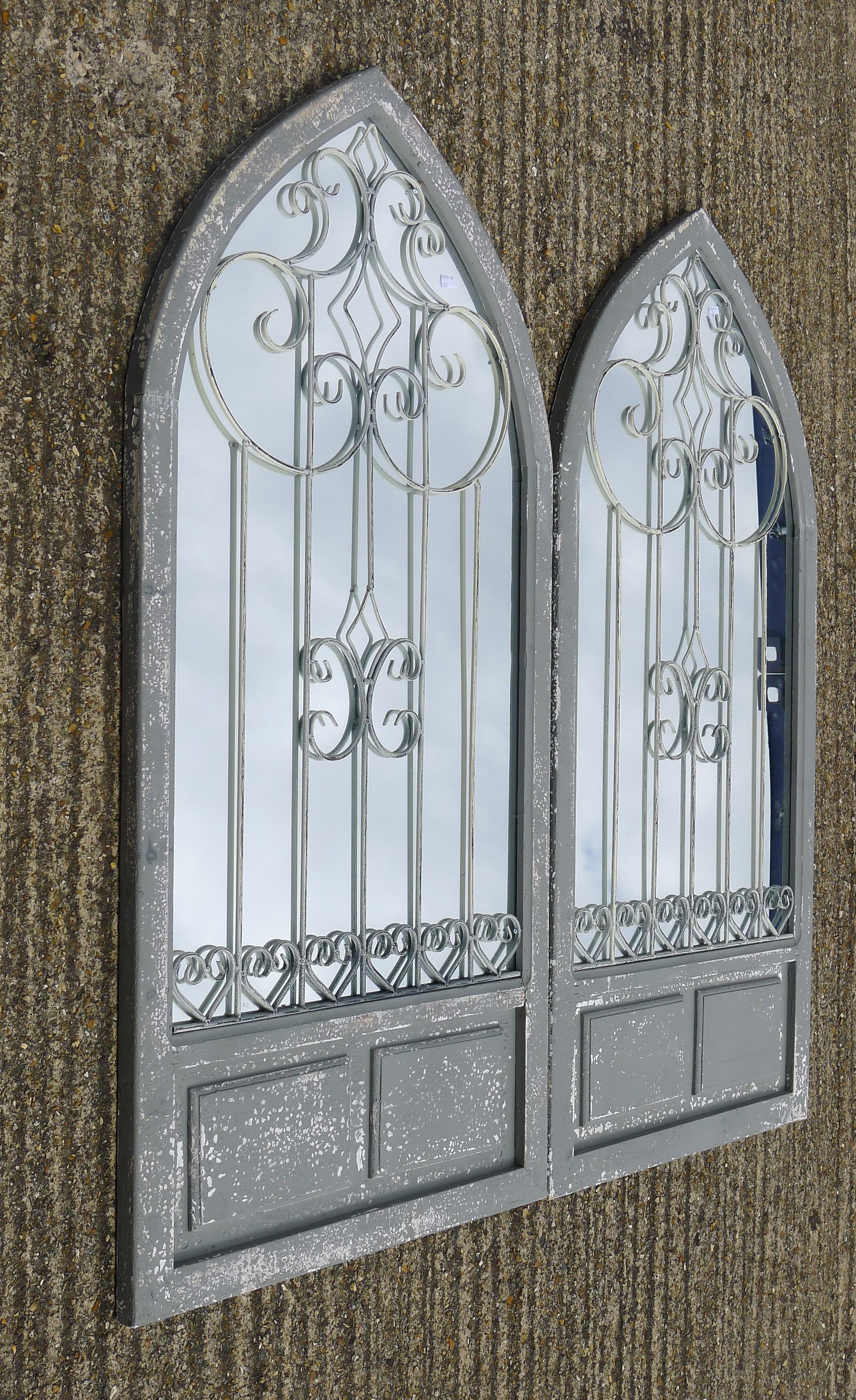 A pair of arch mirrors. 137 cm high.