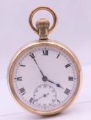 A gold plated open face pocket watch. 5 cm diameter.