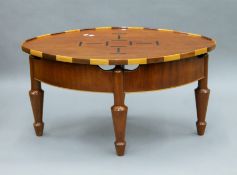 An inlaid mahogany coffee table. 92.5 cm long.