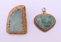 A silver gilt jade brooch and a silver gilt jade pendant. Brooch 3 cm high.